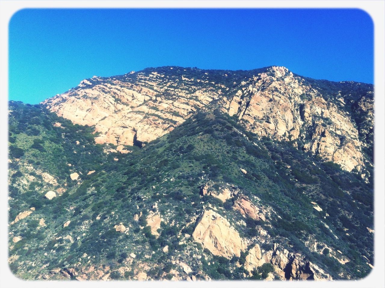 transfer print, auto post production filter, mountain, clear sky, blue, tranquility, tranquil scene, scenics, rock - object, rock formation, beauty in nature, nature, sky, rock, landscape, mountain range, copy space, day, outdoors, low angle view