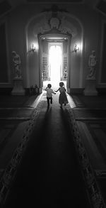 People walking in illuminated church