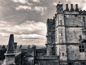 Old building in city against sky