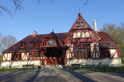 Exterior of old building against clear blue sky