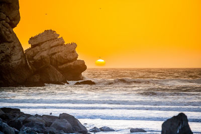 Scenic view of sea against sky during sunset