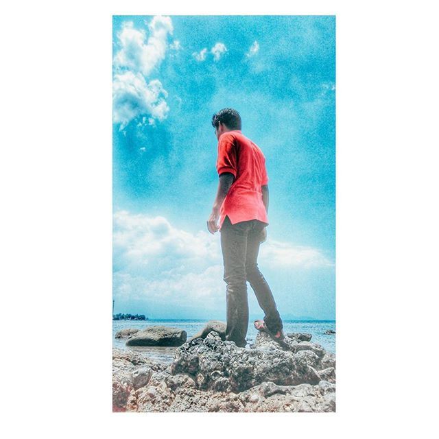 full length, sky, standing, transfer print, beach, sea, rear view, childhood, lifestyles, auto post production filter, water, leisure activity, casual clothing, shore, blue, tranquility, horizon over water, cloud - sky