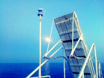 View of sea against clear blue sky