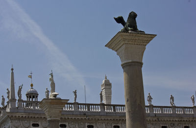 Low angle view of statue against sky