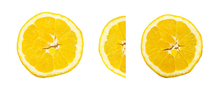 Close-up of lemon slice against white background