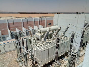Tilt image of machine part against sky