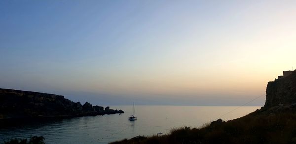 Scenic view of bay against clear sky