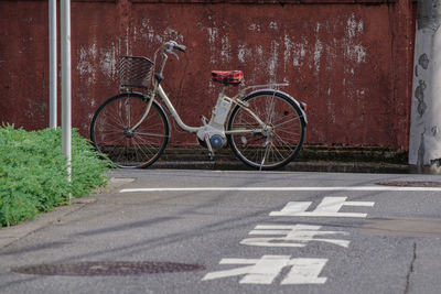 Scenery with a red wall and a bicycle in roppongi 4-chome, tokyo