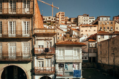 Residential buildings against sky in city