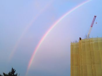 Low angle view of rainbow in sky