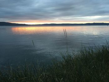 Scenic view of lake against sky during sunset