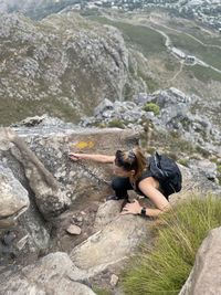 Man sitting on rock