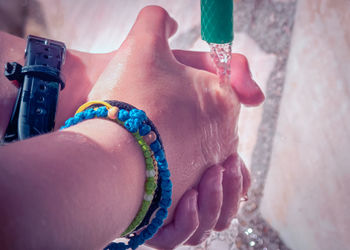 High angle view of woman hand holding hands