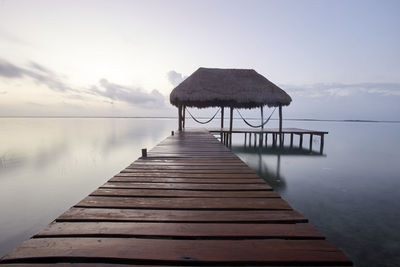 Pier over sea against sky