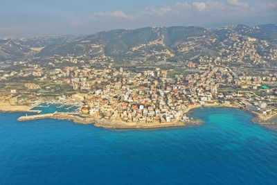 High angle view of city by sea
