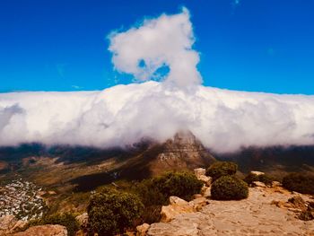 View of volcanic landscape against cloudy sky