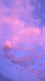 Low angle view of clouds in sky at sunset