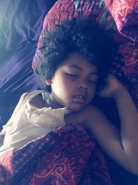 Close-up of cute girl on bed