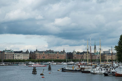Boats moored at harbor