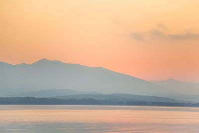 Scenic view of mountains against sky during sunset