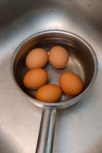 High angle view of eggs in container