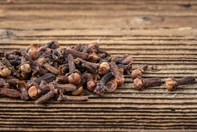 Close-up of roasted coffee beans on table