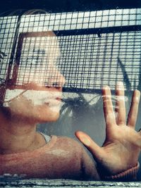 Close-up of hand on water