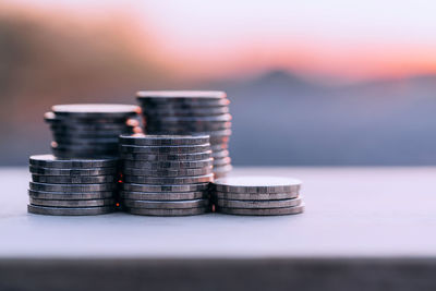 Close-up of coin stack on table