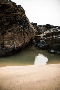 Scenic view of sea with mountain range in background