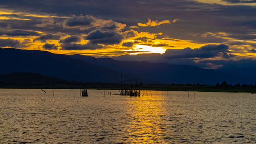 Scenic view of lake against sky during sunset