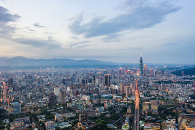 High angle view of modern buildings in city against sky