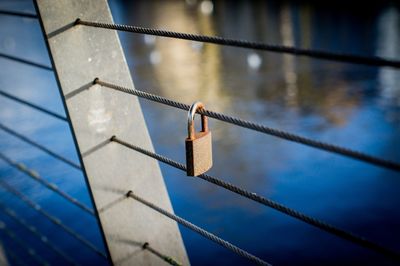 Close-up of padlocks on railing