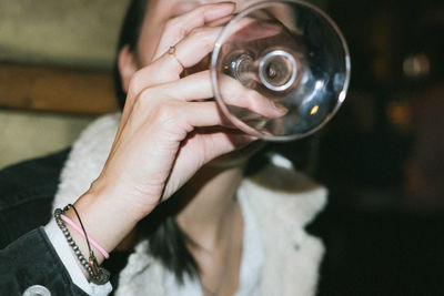 Woman drinking indoors