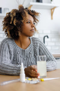 Portrait of young woman using mobile phone