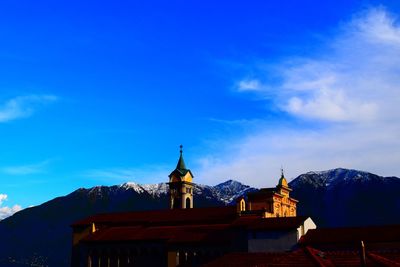 Low angle view of church against blue sky