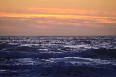 Scenic view of sea at sunset