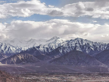 Scenic view of snowcapped mountains against sky