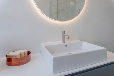 Close-up of sink in bathroom with soap