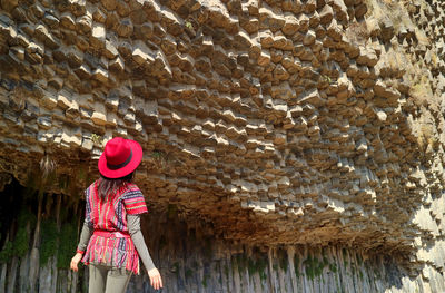 Female being impressed by the incredible stones basalt column formations along the garni gorge