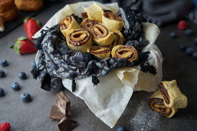 Cake in chocolate rolls with sugar