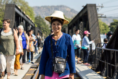 Portrait of people standing outdoors