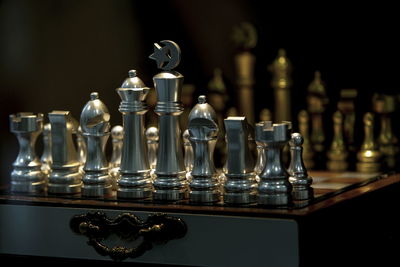 Close-up of chess pieces on table