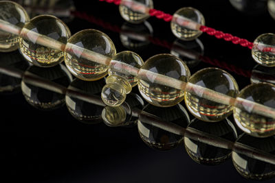Close-up of bead necklace on table