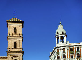 Low angle view of a building against blue sky