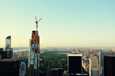 Panoramic view of buildings in city against clear sky