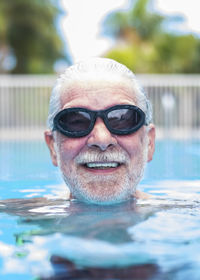 Portrait of woman swimming in pool