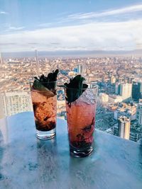 High angle view of drink in city against sky