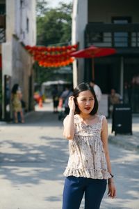 Young woman standing on street