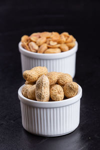 Close-up of sweet food on table against black background