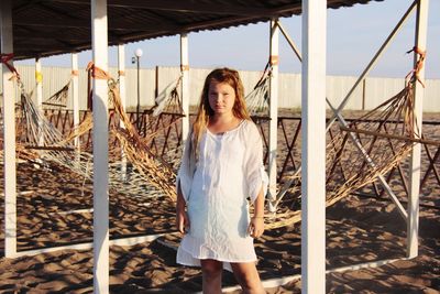 Portrait of girl standing at beach